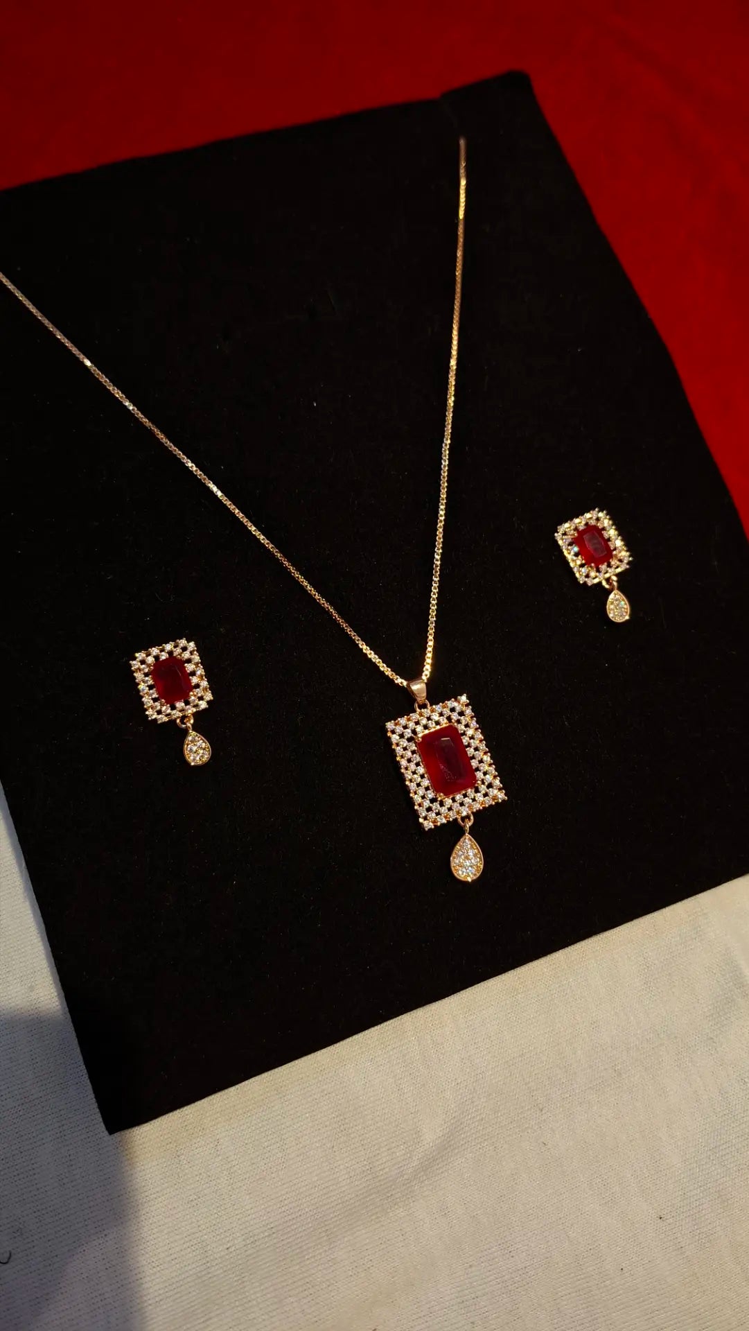 Majestic Crimson Radiance: Emerald-Cut Ruby & Gold Halo Jewelry Set